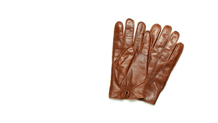 Brown classic leather men's gloves on white isolated background top view. Stylish Fashionable winter autumn spring clothing accessory. Genuine leather gloves