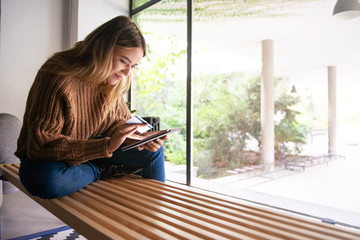 Young women typing on digital tablet, shopping online