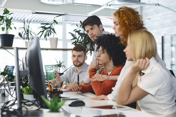 Poster - Fatigued group of young employees looking for business solution
