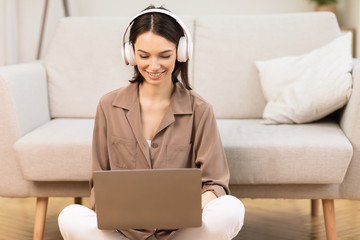 Poster - Girl in headphone playing video games at home