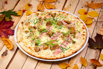 tasty pizza with bacon and herbs