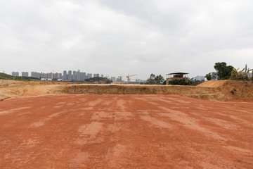 Wall Mural - Wide and flat red dirt construction site