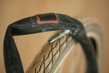 patch on bicycle inner tube. close up and selective focus.