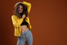 Beautiful Girl In A Yellow Jacket And Kaleidoscope Glasses