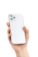 Smartphone With Three Cameras In Hand On A White Background.