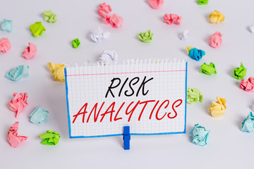 Poster - Word writing text Risk Analytics. Business photo showcasing study of underlying uncertainty of a given course of action Colored crumpled papers empty reminder white floor background clothespin