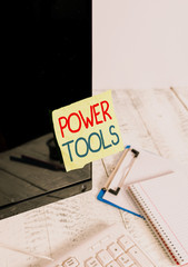 Poster - Writing note showing Power Tools. Business concept for tool that is actuated by additional power source and mechanism Note paper taped to black computer screen near keyboard and stationary