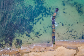 Wall Mural - Aerial top view from drone to the seacoast and old concrete pier, Sea background.