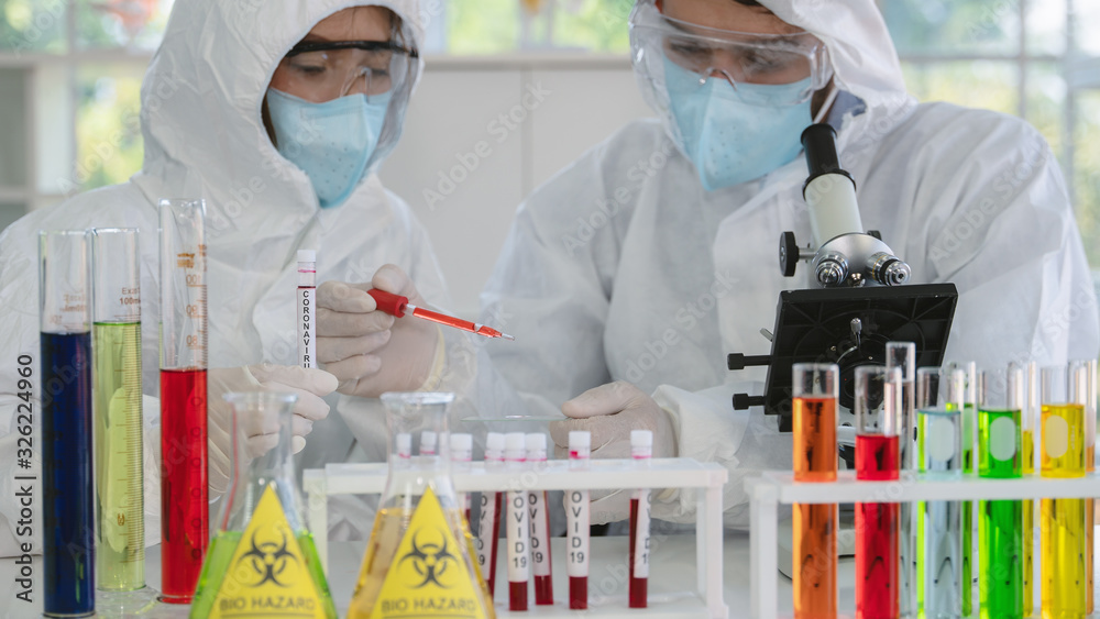 coronavirus covid-19 infected blood sample in sample tube on hand of ...