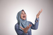 © airdone - Muslim Woman Shows Happy Winning Gesture Greeting Something From Above