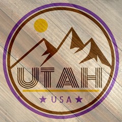 Utah label with mountains and sunshine on wood grain texture