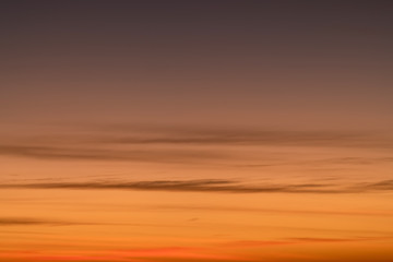 Orange horizon and blue atmosphere. Smooth orange blue gradient of dawn sky.