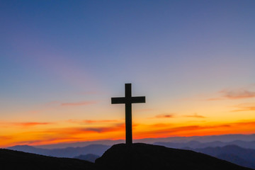 Wall Mural - The silhouette of the crucifixion of Jesus Christ - crossing at sunset