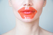 © Angelina - girl puts on a red mask to respect lips