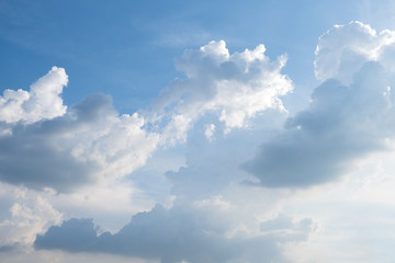 Wall Mural - blue sky background with clouds and sunlight .