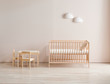 Modern wooden crib and baby room style, pink wall and cabinet decor.