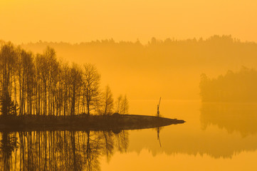 Misty lake at sunrise outside  Gothenburg, Sweden, Europe