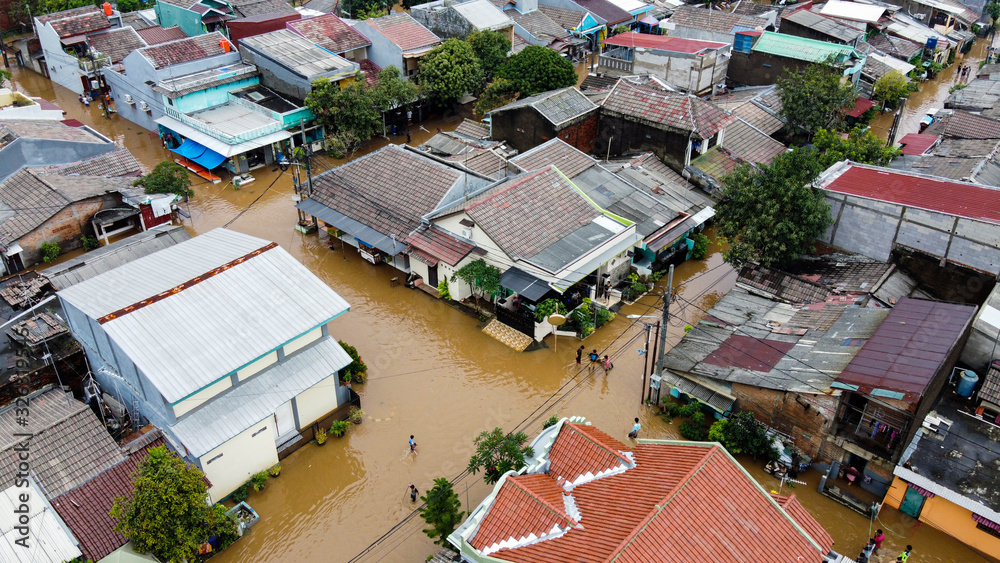 Aerial POV view Depiction of flooding. devastation wrought after massive natural disasters at Bekasi - Indonesia - obrazy, fototapety, plakaty 