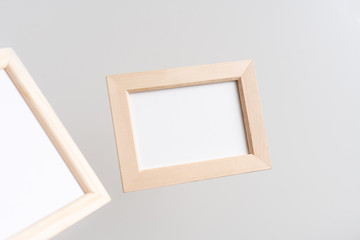 top view of two brown wood photo frame on white