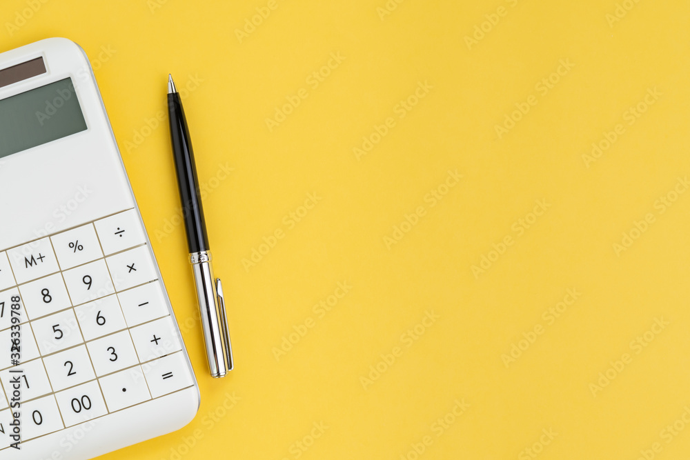 Flat lay or top view of black pen with white calculator on vivid yellow background table with blank copy space, cost and expense, budget, tax, math or investment calculation - obrazy, fototapety, plakaty 