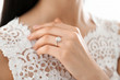 © New Africa - Young bride wearing beautiful engagement ring, closeup