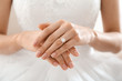 © New Africa - Young bride wearing beautiful engagement ring, closeup