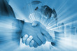 © sittinan - business handshake concept with city and the world background