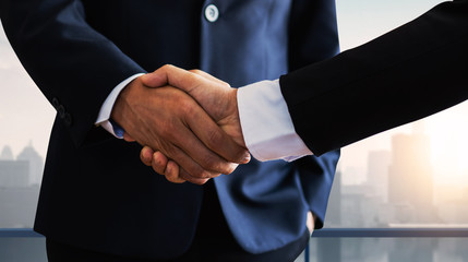 Wall Mural - successful negotiate and handshake concept, two businessman shake hand with partner to celebration partnership and teamwork, business deal.