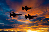 Silhouette army Show performant of air craft in air show with sun sky ocean view at sunset time background.