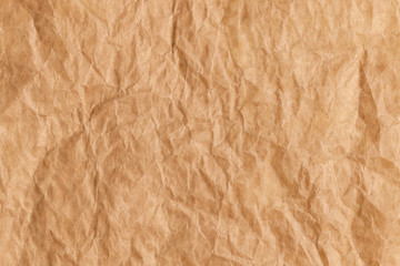 Wall Mural - Top view of used brown baking paper with rough folds and bends. Abstract trendy culinary cooking texture background.