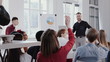 © vadim_key - Happy middle aged coach businessman giving talk at modern office conference to multiethnic team slow motion RED EPIC.