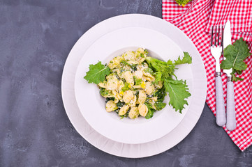 Wall Mural - orecchiette alla pugliese, homemade Italian pasta. Orecchiette with turnip tops. Traditional food of the south of Italy, on a white background. Copy space