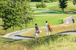 © freebird7977 - Group golf professional Golfer asian man walking in fairway with bag golf at golf  club.  Hobby in holiday and vacation with friends.  Lifestyle and Sport Concept