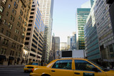 Fototapeta Miasta - Yellow cabs on Park Avenue in midtown Manhattan, New York City, Unites States