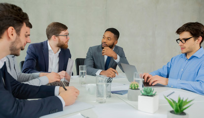 Poster - Business meeting. Multiracial businesspeople having discussion in office