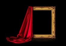 The Wooden Frame For The Picture Is Covered With A Silk Red Cloth Isolated On A Black Background. Antique Golden Frame.
