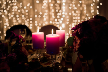 pink candles with bokeh