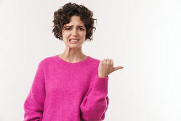 Poster - Image of young displeased woman grimacing and pointing finger aside