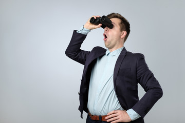 Sticker - Young businessman looking to the future through binoculars