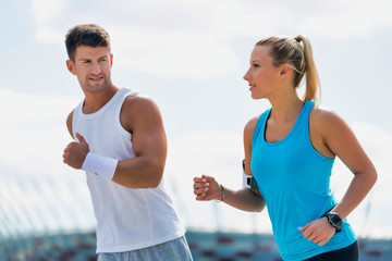 Young couple excersising in park