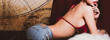 © Sasils Production - Cute asian woman sitting on sofa. Looking from behind. For seductive sensuality and provocative desire concept. Vintage filter look. Banner frame.