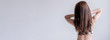 © Sasils Production - Cute asian woman sitting in bed. About to touch her hair, copy space. In bedroom. Sexy and cute concept. Banner frame.