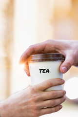 Wall Mural - Close up photo of businesswoman giving businessman a cup of tea