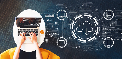 Wall Mural - Cloud computing with person using a laptop on a white table