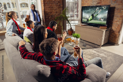 Excited Group Of People Watching Football Soccer Sport Match At Home Multiethnic Group Of Emotional Friend Fans Cheering For Favourite National Team Drinking Beer Concept Of Emotions Support Buy This Stock