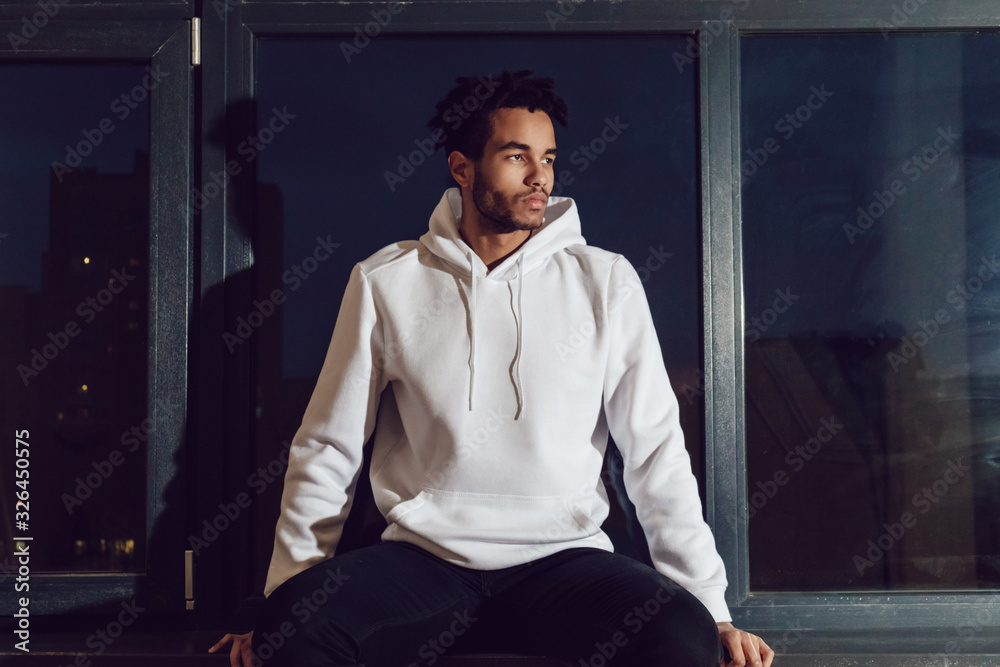 Attractive african american man in hoodie sweater. Mock-up. - obrazy, fototapety, plakaty 