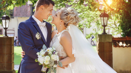 Wall Mural - beautiful wedding couple on sunny day are happy