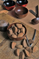 Wall Mural - Wooden bowl with Brazil nuts on rustic wooden table