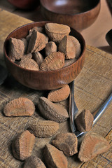 Wall Mural - Wooden bowl with Brazil nuts on rustic wooden table