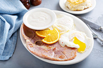 Wall Mural - Traditional ham and eggs breakfast with biscuits